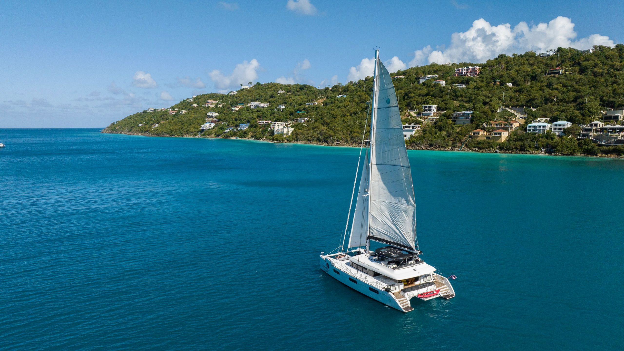 Ripple catamaran anchored in turquoise Caribbean waters